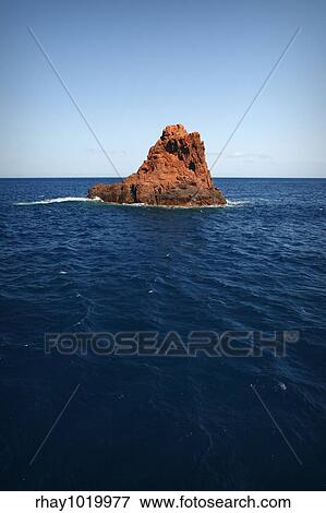 Stock Photo - "The UNESCO World Heritage site of Scandola, Corsica, in France. Beautiful nature reserve in the mediterranean, an impressive, porphyritic rock mass. ". Fotosearch