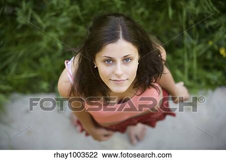 "The young girl with blue eyes and dark hair looks in a shot, having lifted a headThe young girl with blue eyes and dark hair looks in a shot, having lifted a head" View Large Photo Image Stock Image - "The young girl with blue eyes and dark hair looks in a shot, having lifted a headThe young girl with blue eyes and dark hair looks in a shot, having lifted a head". Fotosearch