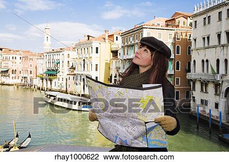 Stock Image - tourist attractions: this girl got lost in Venice. Fotosearch