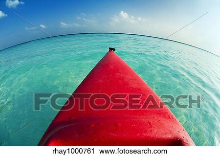 tropical beach: red canoa on the seashore View Large Photo Image Stock Image - tropical beach: red canoa on the seashore. Fotosearch