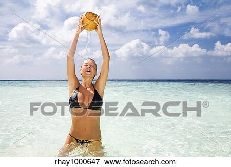 tropical beach: woman relaxing on a tropical beach View Large Photo Image Stock Photo - tropical beach: woman relaxing on a tropical beach. Fotosearch