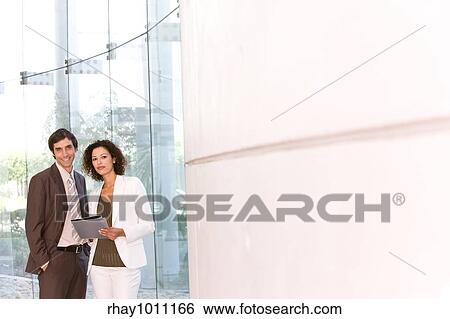 two office workers standing View Large Photo Image Stock Photograph - two office workers standing. Fotosearch