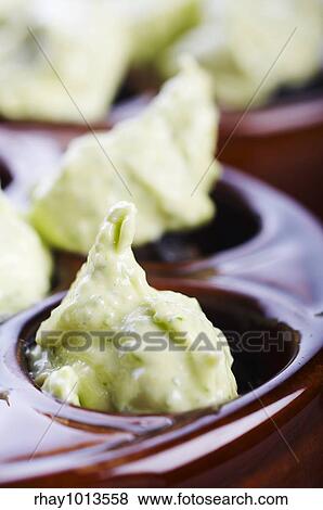 Uncooked snails with garlic and butter on the table View Large Photo Image Stock Photo - Uncooked snails with garlic and butter on the table. Fotosearch