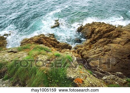 "View down the cliffs at Atlantic ocean coast in Brittany, France" View Large Photo Image Stock Photo - "View down the cliffs at Atlantic ocean coast in Brittany, France". Fotosearch