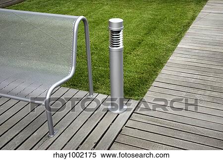 View of a modern bench in the park View Large Photo Image Stock Photography - View of a modern bench in the park. Fotosearch