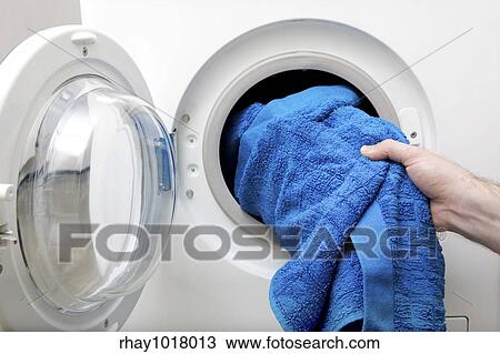 Washing clothes in a front loading washer View Large Photo Image Stock Image - Washing clothes in a front loading washer. Fotosearch