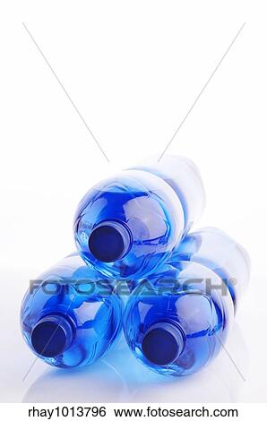 Water bottles on the white reflective background View Large Photo Image Stock Photograph - Water bottles on the white reflective background. Fotosearch