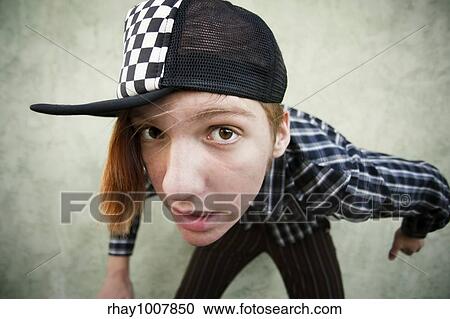 Wide angle shot of a teenage in front of a green stucco wall View Large Photo Image Stock Image - Wide angle shot of a teenage in front of a green stucco wall. Fotosearch