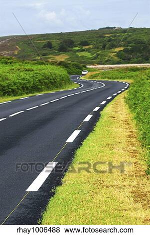 Stock Photo - "Winding road along the ocean coast in Brittany, France". Fotosearch