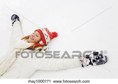 winter scene: blond girl laying down on the snow. Copy space on the right side View Large Photo Image Stock Image - winter scene: blond girl laying down on the snow. Copy space on the right side. Fotosearch