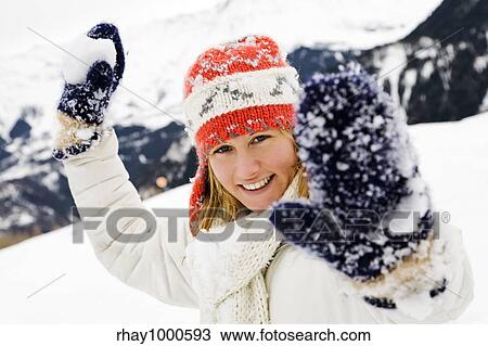 winter scene: girl playing with snowballs View Large Photo Image Stock Image - winter scene: girl playing with snowballs. Fotosearch