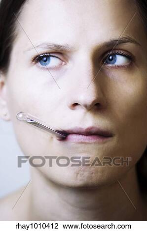 woman with thermometer in her mouth View Large Photo Image Stock Image - woman with thermometer in her mouth. Fotosearch