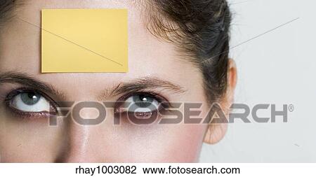 yellow post it on face View Large Photo Image Stock Image - yellow post it on face. Fotosearch
