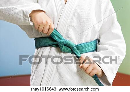 Stock Image - young boy preparing to perform judo. Fotosearch