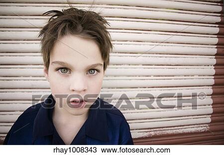 Young Boy with a Blank Stare and Green Eyes View Large Photo Image Stock Image - Young Boy with a Blank Stare and Green Eyes. Fotosearch