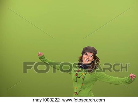 Young happy woman in a green background View Large Photo Image Stock Image - Young happy woman in a green background. Fotosearch