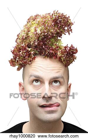 Young man contemplating on whether to eat the lettuce on top of his head or not. Isolated against a white background. View Large Photo Image Stock Image - Young man contemplating on whether to eat the lettuce on top of his head or not. Isolated against a white background.. Fotosearch
