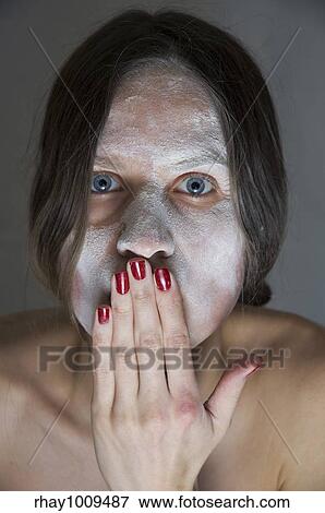 "young woman covered in white powder(""speak no evil"" expression)" View Large Photo Image Stock Photo - "young woman covered in white powder(""speak no evil"" expression)". Fotosearch