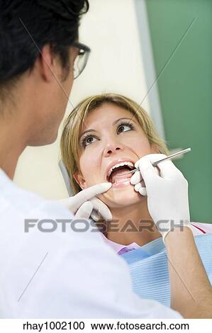 young woman doing dental checkup View Large Photo Image Stock Image - young woman doing dental checkup. Fotosearch