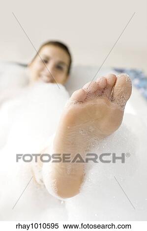 Young woman enjoying the bath-foam in the bathtub. View Large Photo Image Stock Photography - Young woman enjoying the bath-foam in the bathtub. . Fotosearch