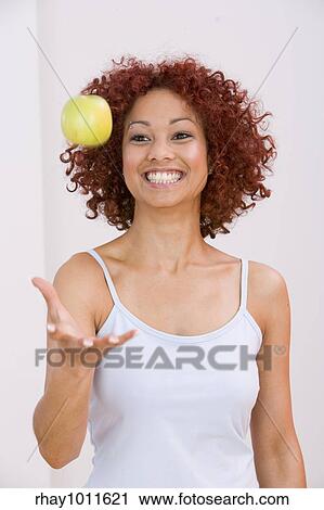 young woman in vest relaxing View Large Photo Image Stock Image - young woman in vest relaxing. Fotosearch