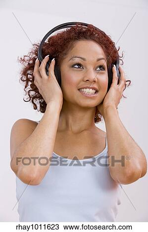 young woman in vest relaxing View Large Photo Image Stock Image - young woman in vest relaxing. Fotosearch
