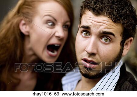 Young woman yells at man with beard View Large Photo Image Stock Photo - Young woman yells at man with beard. Fotosearch