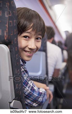Boy on aeroplane View Large Photo Image Stock Photo - Boy on aeroplane. Fotosearch