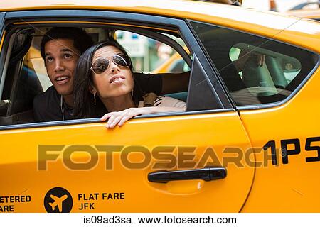 Couple looking up from cab window View Large Photo Image Stock Image - Couple looking up from cab window. Fotosearch