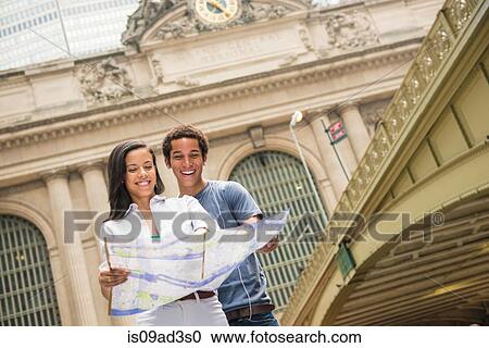 Couple reading map View Large Photo Image Stock Image - Couple reading map. Fotosearch