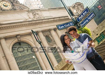 Couple reading map View Large Photo Image Stock Photo - Couple reading map. Fotosearch