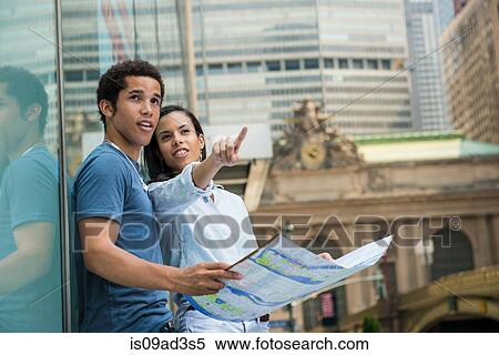 Couple reading map View Large Photo Image Stock Photography - Couple reading map. Fotosearch