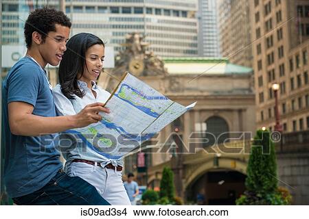 Picture - Couple reading road map. Fotosearch