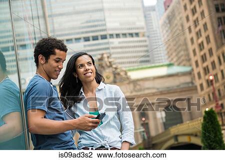 Couple reading text message on mobile phone View Large Photo Image Stock Image - Couple reading text message on mobile phone. Fotosearch