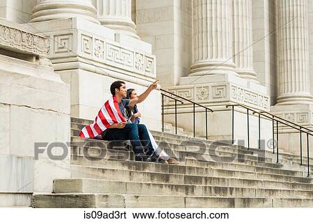 Couple with American flag View Large Photo Image Stock Photograph - Couple with American flag. Fotosearch