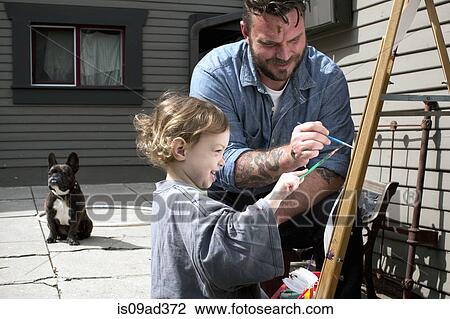 Father and daughter outdoors painting on easel View Large Photo Image Stock Image - Father and daughter outdoors painting on easel. Fotosearch