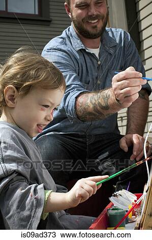 Father and daughter outdoors painting on easel View Large Photo Image Stock Image - Father and daughter outdoors painting on easel. Fotosearch