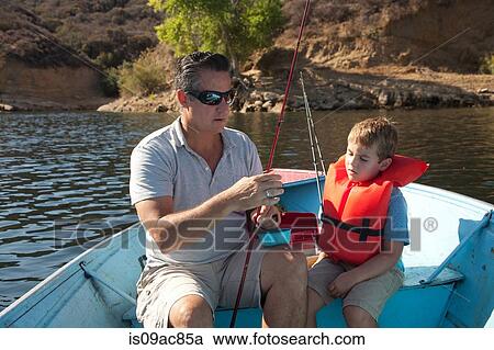 Stock Image - Father and son on fishing trip. Fotosearch
