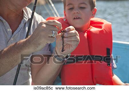 Stock Image - Father and son on fishing trip. Fotosearch