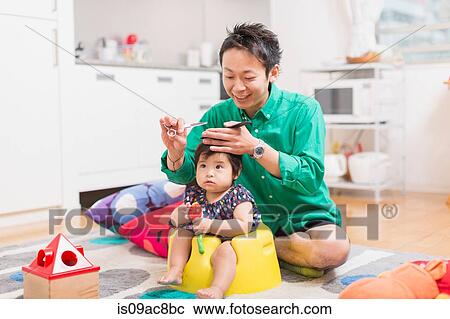 Father cutting baby's hair on floor View Large Photo Image Stock Image - Father cutting baby's hair on floor. Fotosearch