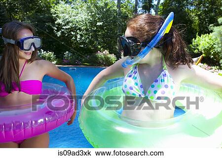 Friends playing by pool View Large Photo Image Stock Image - Friends playing by pool. Fotosearch