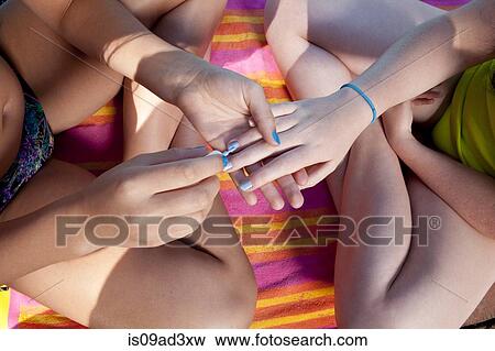 Friends playing with nail color View Large Photo Image Stock Photo - Friends playing with nail color. Fotosearch