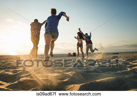 Friends running on Mission Beach, San Diego, California, USA View Large Photo Image Stock Image - Friends running on Mission Beach, San Diego, California, USA. Fotosearch
