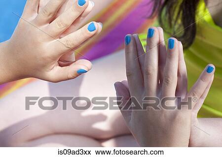 Stock Photo - Friends touching hands. Fotosearch