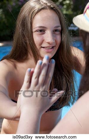 Stock Photo - Friends touching hands. Fotosearch