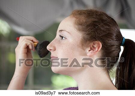 Girl buffing cheek View Large Photo Image Stock Photo - Girl buffing cheek. Fotosearch