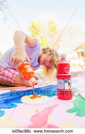 Girl painting with tempera on paper View Large Photo Image Stock Image - Girl painting with tempera on paper. Fotosearch