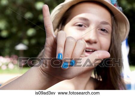 Girl with painted finger nails View Large Photo Image Stock Photo - Girl with painted finger nails. Fotosearch