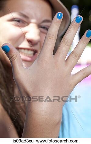 Girl with painted finger nails View Large Photo Image Stock Photograph - Girl with painted finger nails. Fotosearch