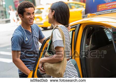 Man opening cab door for woman View Large Photo Image Stock Image - Man opening cab door for woman. Fotosearch